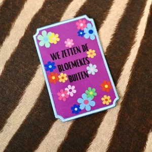 Embleem We zetten de bloemekes buiten (paars)